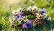 rustic wildflowers wreath on sunny meadow summer solstice day midsummer concept floral traditional decor pagan witch traditions wiccan symbol and rituals