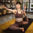 © Miljan Živković - Japanese mature woman practice yoga at home