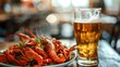 Boiled crayfish and glass of beer on table in restaurant