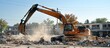 An excavator loader at work excavating, crushing and loading building materials at a demolition construction site.