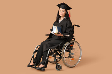 Wall Mural - Beautiful female graduate student in wheelchair with graduation cap and books on brown background