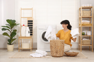 Poster - Woman with laundry near washing machine indoors