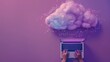© CNISAK - A person typing on laptop with cloud technology concept, purple background, top view