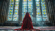 Before a stained-glass window in a cathedral, a devout Muslim woman prays
