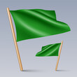 Vector illustration of two 3D-looking green color flag icons with wooden sticks, isolated on grey background. Created using gradient meshes, EPS 10 vector