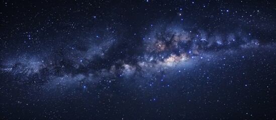 Wall Mural - the milky way, a stunning band of stars and planets, is visible in the dark expanse of the night sky