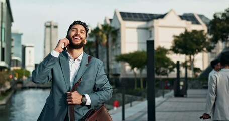 Canvas Print - Businessman, walking and city with happiness and phone call for good news with briefcase for work. Male person, entrepreneur and smartphone for communication in Dubai and business conversation.