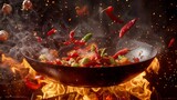 Fototapeta Miasto - Freeze Motion of Wok Pan with Flying Ingredients in the Air and Fire Flames.