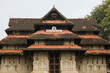 Vadakkumnathan or lord shiva ancient old traditional style south indian hindu religion stone temple building in kerala, thrissur. Front view with Om Namah Shivaya Mantra text in Malayalam