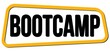 BOOTCAMP text on yellow-black trapeze stamp sign.