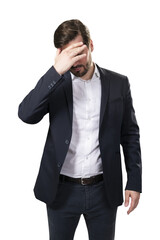 Canvas Print - A distraught businessman in a suit covering his face with his hand, isolated on a white background, depicting stress or failure