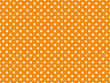 texturised white color polka dots over dark orange background