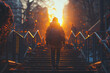A person walking up the stairs at sunrise, with their back to camera, carrying backpack and looking towards