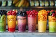 A gradient of smoothie layers, fruit flavors visualized