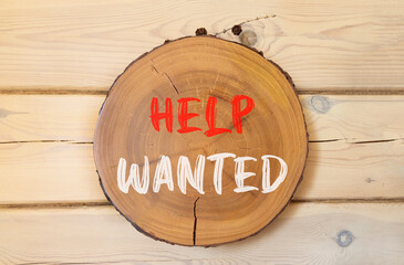 Wall Mural - Help wanted and support symbol. Concept words Help wanted on beautiful wooden circle. Beautiful wooden wall background. Business, support, help wanted concept. Copy space.