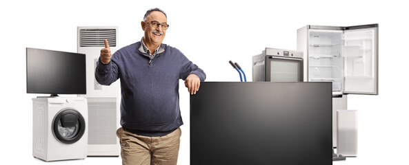 Poster - Mature man gesturing thumbs up next to a flat tv screen and home appliances