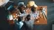 © InfiniteFlow - Top down aerial view of skilled designer hold logo while discuss with team. Aerial business group working together sharing idea about logo graphic design by using sticky notes and tablet. Symposium.
