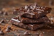 Deliciously detailed dark chocolate chunks with chocolate chips piled on a wooden texture
