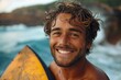 Bronzed surfer grinning with surfboard against rough sea backdrop