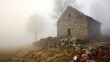 Stone cottage foggy scene