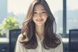 A beautiful young Korean woman in her early to mid 20s, smiling warmly and standing upright with long hair, wearing an elegant white blouse