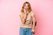 Young caucasian woman wearing neck brace isolated on pink background with surprise and shocked facial expression