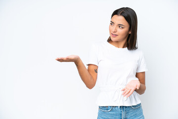 Wall Mural - Young caucasian woman isolated on white background with surprise expression while looking side