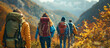 Group of tourists with backpacks hiking in the mountains in autumn.
