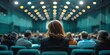 Defocused image of a busy conference room with people attending meetings and presentations in a corporate setting