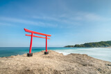 Fototapeta Kwiaty - Red torii gate by the sea, Shimoda beach, Shizuoka Prefecture, Japan