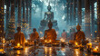 A group of monks are sitting in a temple with candles lit around them