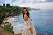 © Sergey - A stunning portrait of a bride on a cliff