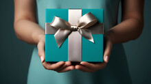 Gracious Gifting: Hands Presenting A Tiffany Blue Box With Silver Ribbon