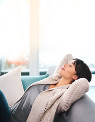 Wall Mural - Woman, relax and sofa in house for wellness, peace and sleep on weekend with zen. Female person, comfort and couch in home on Saturday for mental health, calm and rest with pillow, silent and leisure