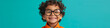 Happy Curly-Haired Child Wearing Glasses on Blue Background