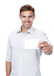 © peopleimages.com - Studio, blank card and portrait of man with mockup, introduction and isolated on white background. Signage, business offer and happy male person with paper for news, announcement or deal information