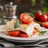 Fototapeta Mapy - Salad with mozzarella and tomatoes