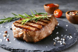 Fototapeta Mapy - Ready grilled steak on cutting board
