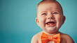 cute smiling baby face with neat bow tie isolated on blue background created with Generative AI Technology