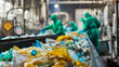 Workers in Safety Gear Sorting Recyclable Materials on a Conveyor Belt in a Waste Management Facility