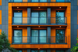 A tall building featuring a plethora of windows and balconies in a modern design