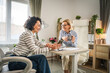 © Miljan Živković - Two mature woman have coffee break at office