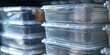 Close-up of stackable clear storage bins, soft light, orderly and transparent 