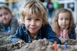 Joyful child exploring the sandbox,embracing hands-on experiential learning in an engaging educational environment