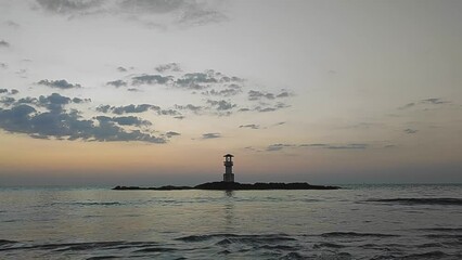 Wall Mural - Silhouette lighthouse with sunset and red twilight sky on the rock at Nang Thong Beach at Khao Lak Phang Nga Thailand - Seascape chill vibe on the beach - beautiful sky - Travel Landscape Thailand 