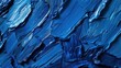 A close-up of beautiful brushstrokes on a blue background, captured in rich oil paint