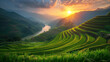 The setting sun casts a golden glow over the expanse of terraced rice fields, with a meandering river flowing through the mountain valley.