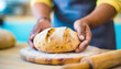 © Carlostock - Mom homemaker prepares a homemade artisan bread recipe for her family, surprising them at the family dinner