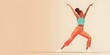 Joyful woman dancer leaping with outstretched arms capturing the dynamic energy and expressiveness of fitness and dance based workout routines
