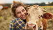 © Adin - Concept agriculture cattle livestock farming industry. Smiling Happy young woman farm worker hugging cow as sign of concern for animal health care in field, sunlight.